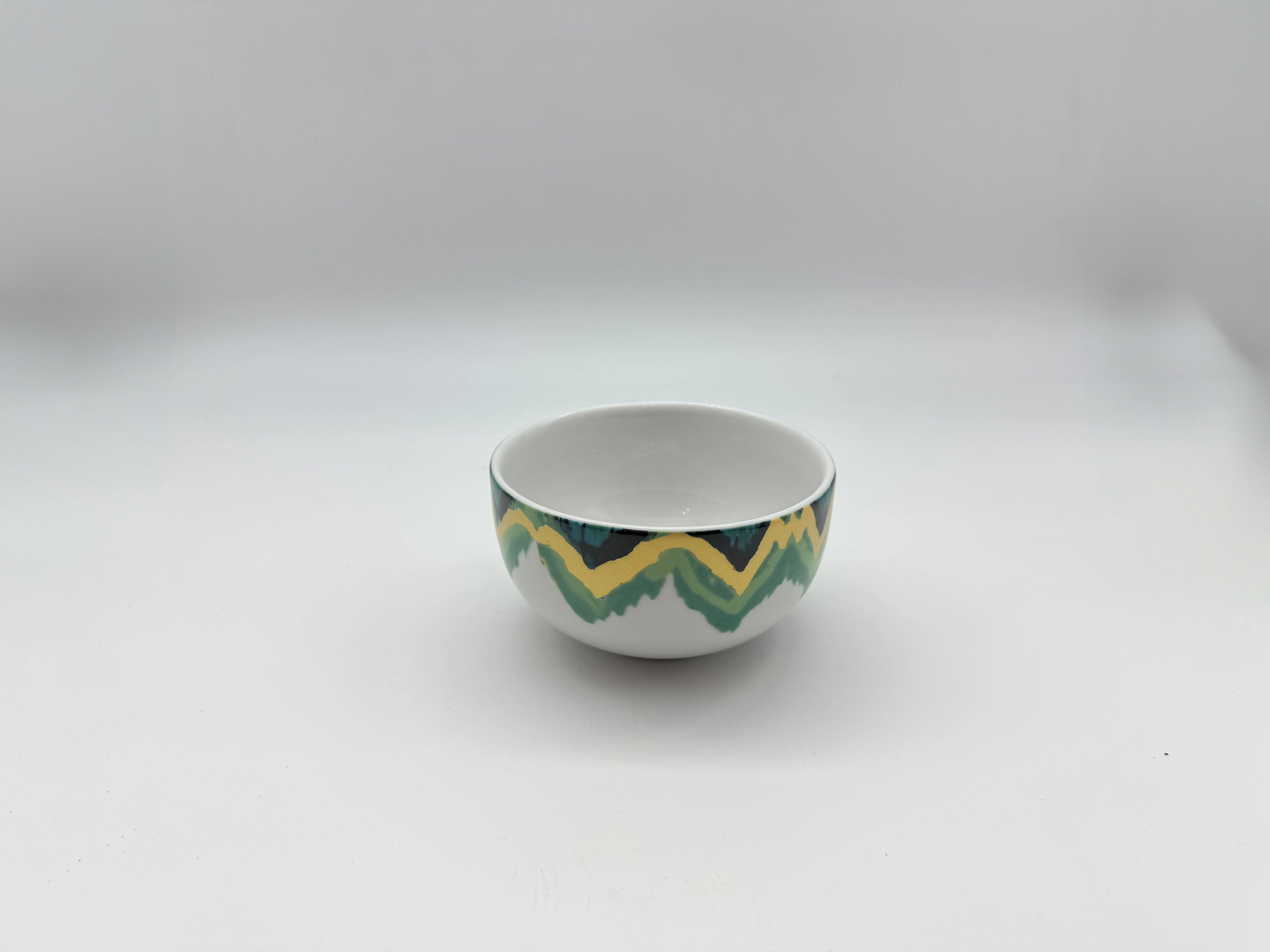 Aqua Zigzag porcelain bowl showing teal and yellow zigzag artwork
