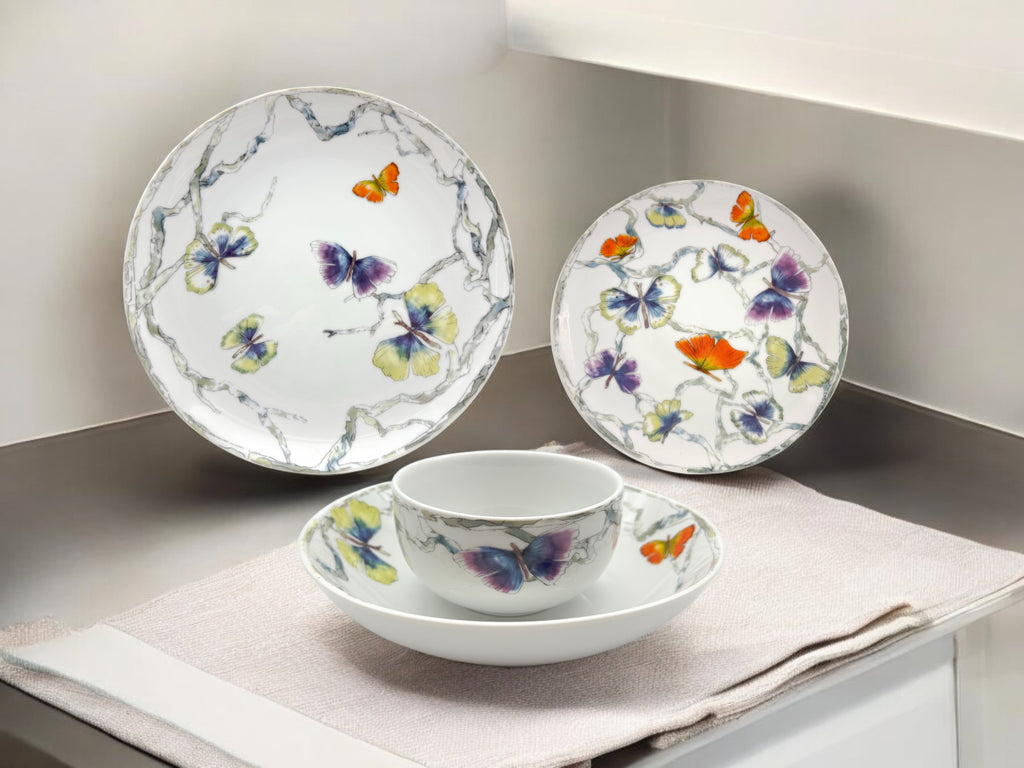Butterfly porcelain dinnerware set with plates and bowl displayed in a kitchen lifestyle setting
