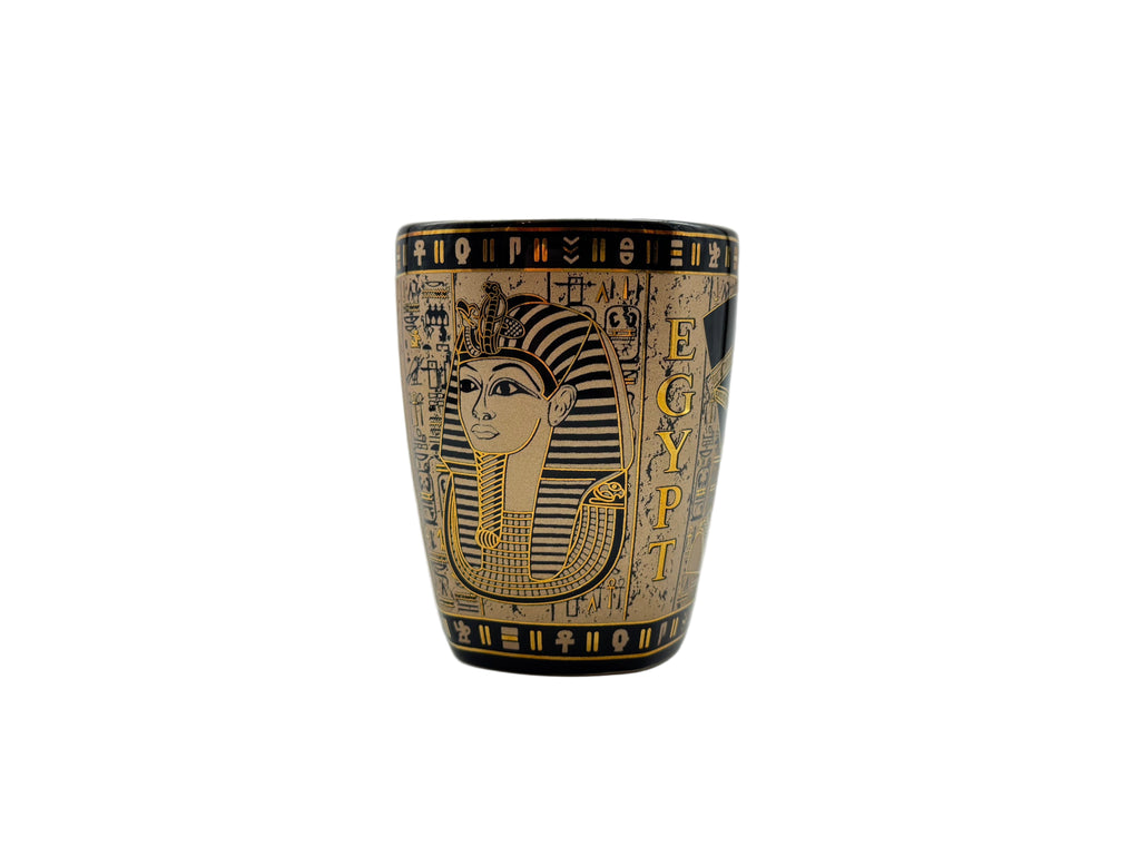Porcelain mug with Egyptian pharaoh design and hieroglyphics in beige and gold.