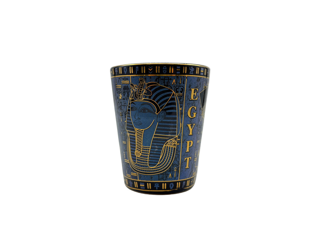 Porcelain mug with Egyptian pharaoh design and hieroglyphics in blue and gold.