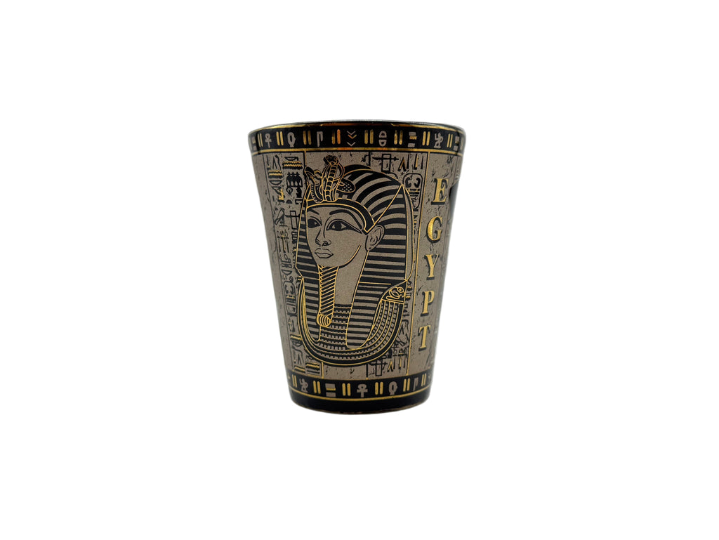 Porcelain mug with Egyptian pharaoh design and hieroglyphics in bronze and gold.