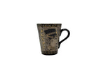 Egyptian porcelain mug with Cleopatra artwork in bronze and gold – front view.