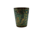 Porcelain mug with Egyptian pharaoh design and hieroglyphics in green and gold.