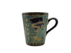 Egyptian porcelain mug with Cleopatra artwork in green and gold – front view.