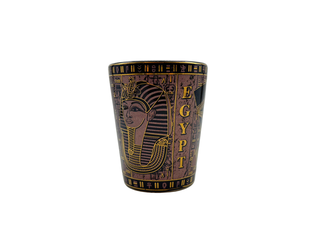 Porcelain mug with Egyptian pharaoh design and hieroglyphics in pink and gold.