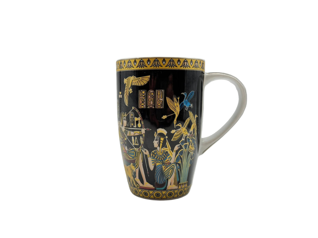 Front view of the Mesu Hunter Mug, a black ceramic mug with gold ancient Egyptian artwork and papyrus motifs, photographed on a white background