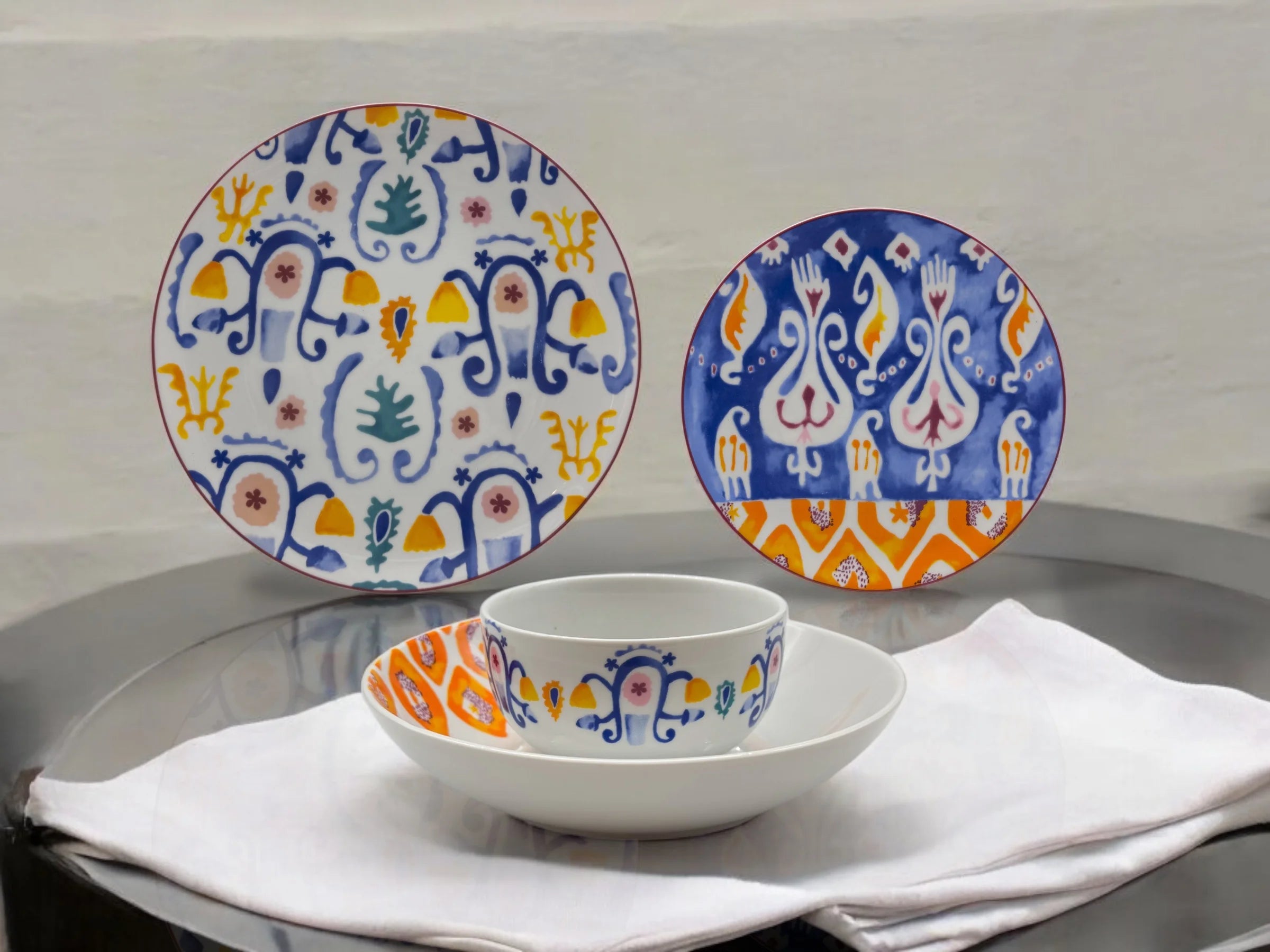Mosaic Bloom collection including dinner plate, dessert plate, deep plate, and soup bowl