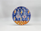 Mosaic Bloom dessert plate featuring bold blue and orange artistic design
