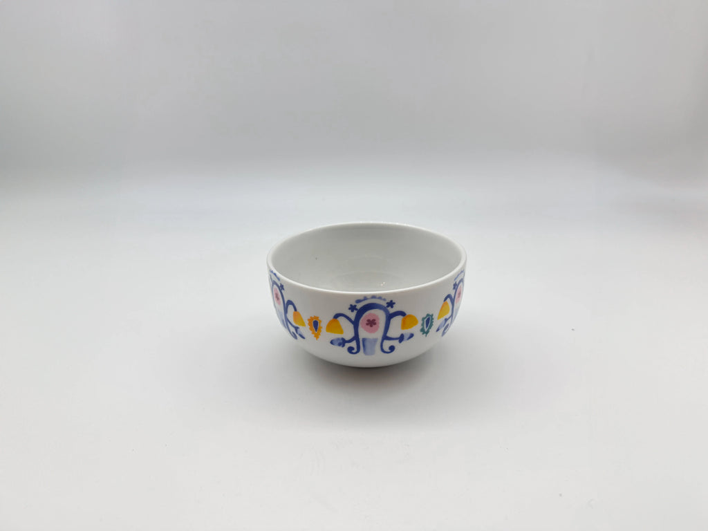 Angled view of Mosaic Bloom soup bowl showing detailed multicolor pattern