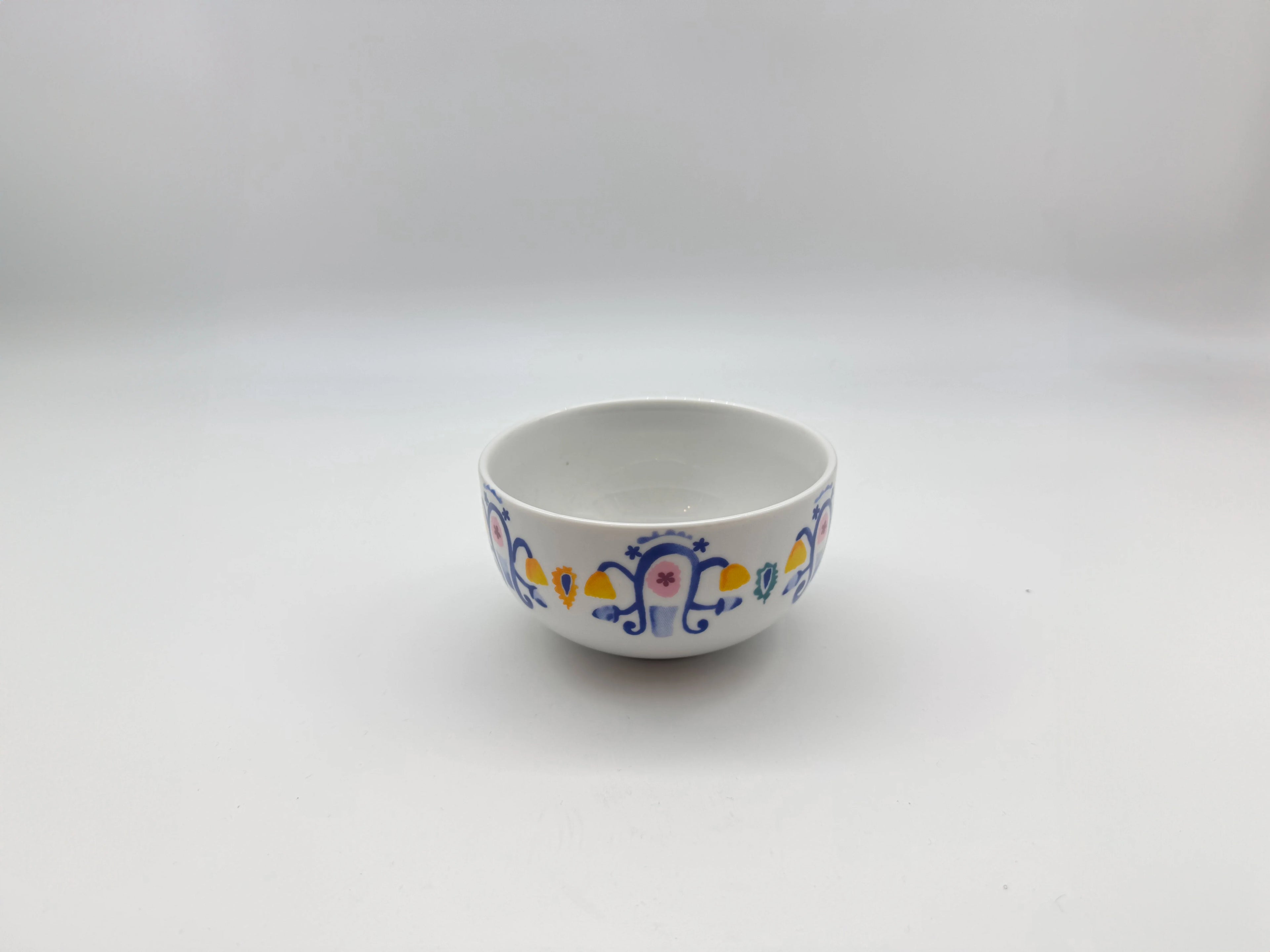 Angled view of Mosaic Bloom soup bowl showing detailed multicolor pattern