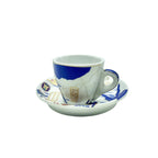 Side view of the Nile Valley Map cup and matching saucer featuring blue-and-white Egyptian map design