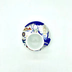 Top-down view of the Nile Valley Map cup placed on its matching plate with illustrated Egypt map artwork