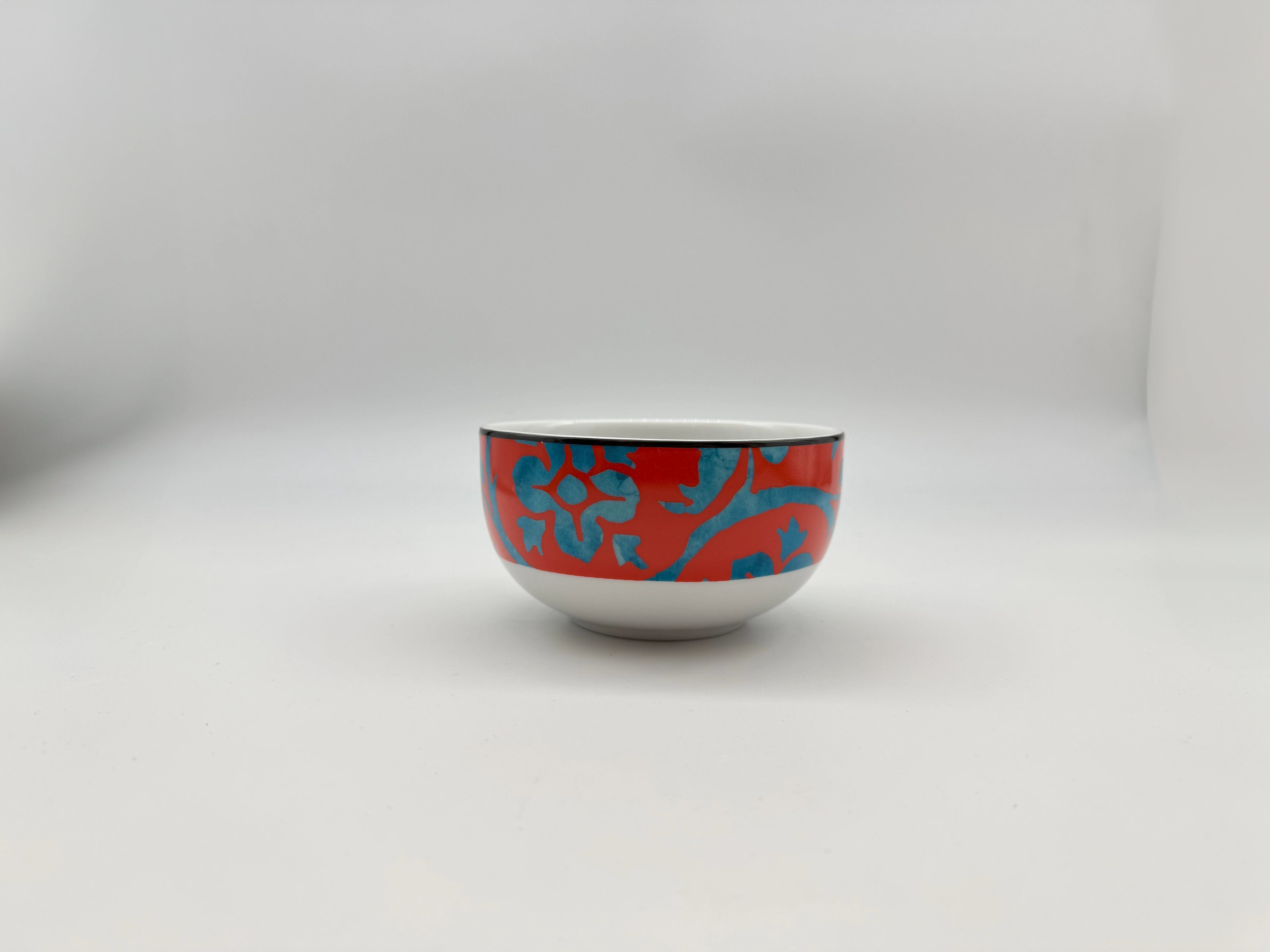 Red and blue patterned porcelain soup bowl front view