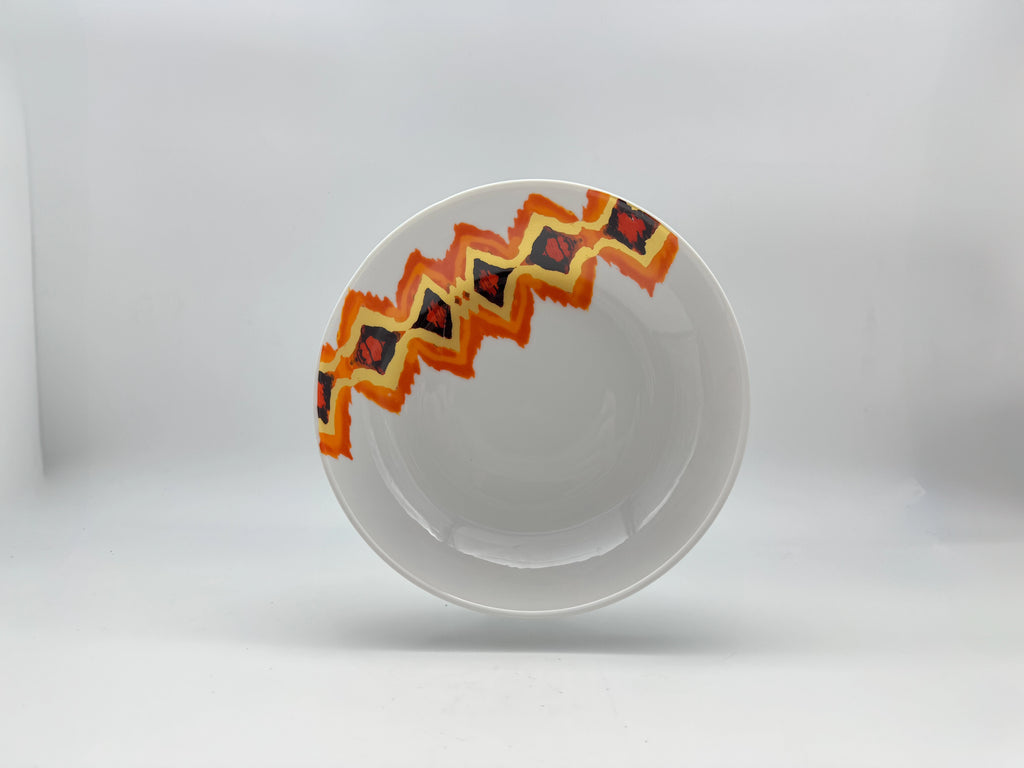 Sunset Zigzag porcelain deep plate with decorative geometric orange design.