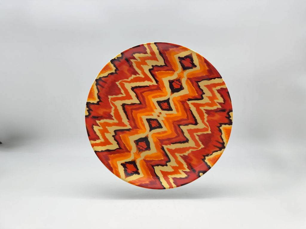 Sunset Zigzag porcelain dinner plate with orange and red geometric pattern